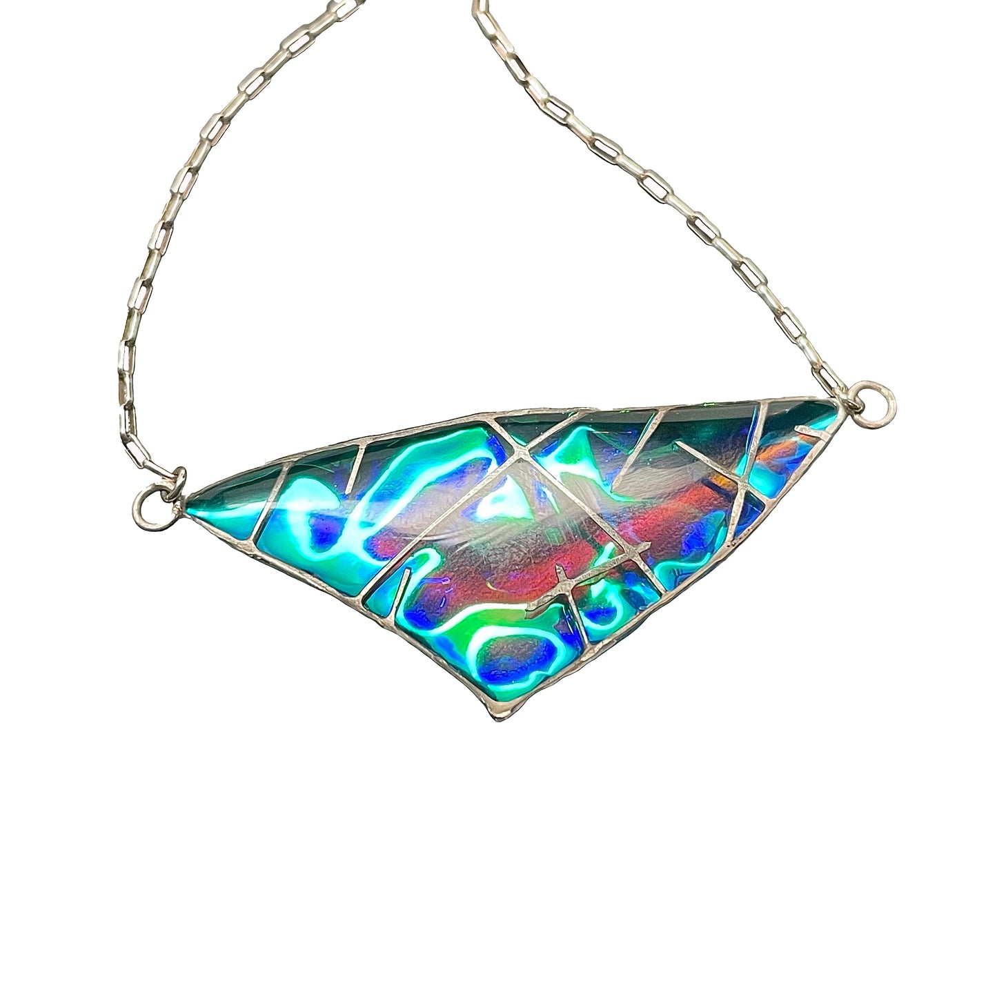 Stunning, unique, magical jewelry that plays with light, shadow and color. This necklace represents a fairy wing from the fae jewelry line. It is a bright iridescent triangle pendant that has shards of silver encased within and above the iridescent resin. Jay Bird Studios art shares the dreamy and exciting aspects of fantasy and sci fi in the context of jewelry that can be used to dress up, for drag queens, and cos play in addition to it's everyday appeal.